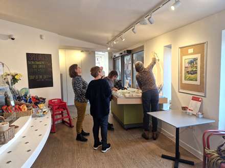 Hanging the first exhibition at Eling tide Mill Experience Cafe